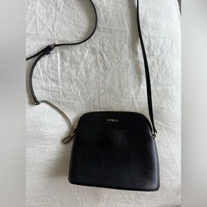 Like new Furla crossbody bag, black and gold chain